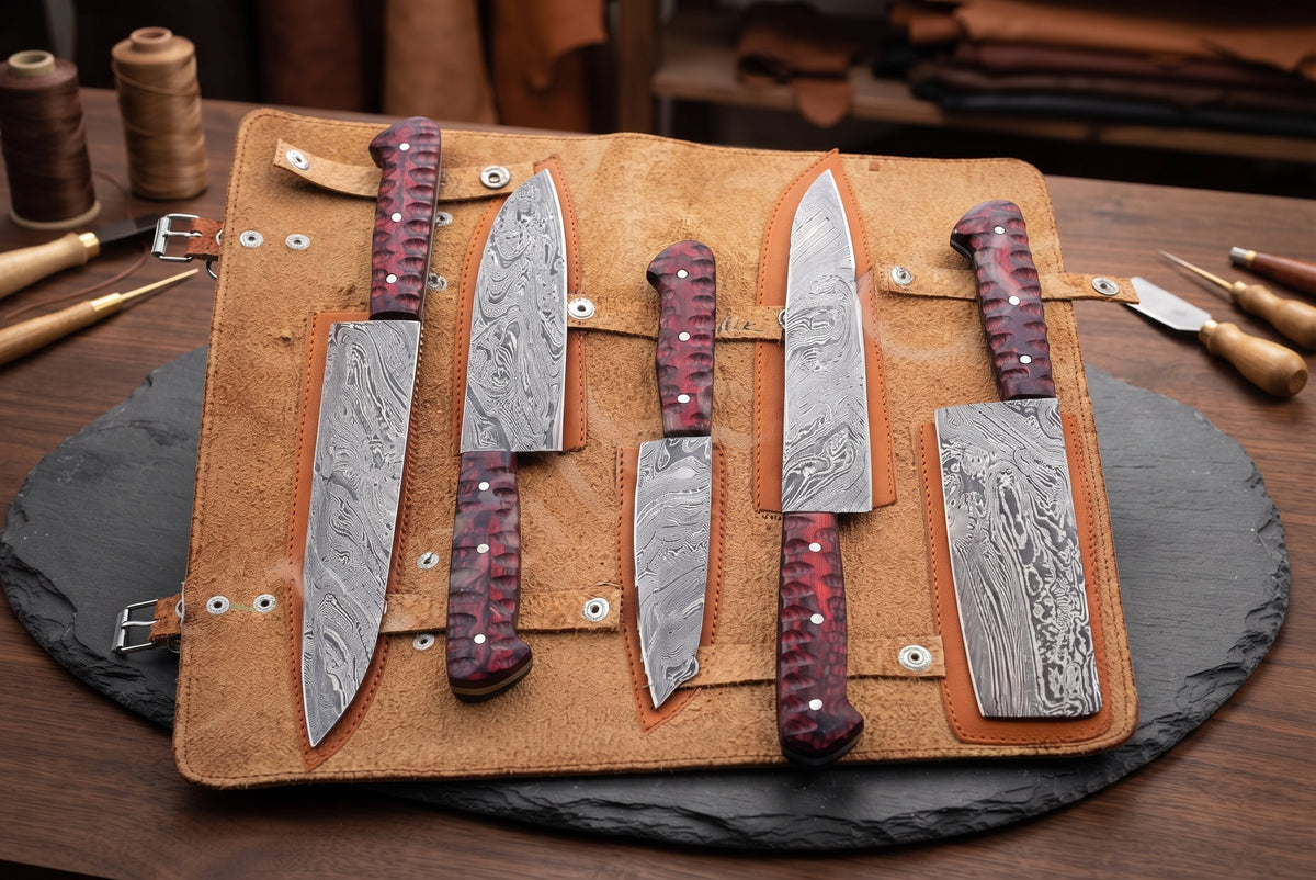 Damascus knife set in open leather case with workshop tools