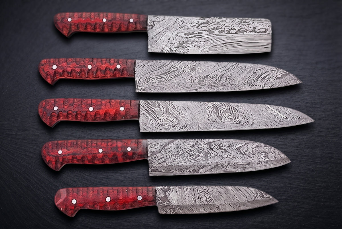 5 Damascus knives with red handles arranged diagonally