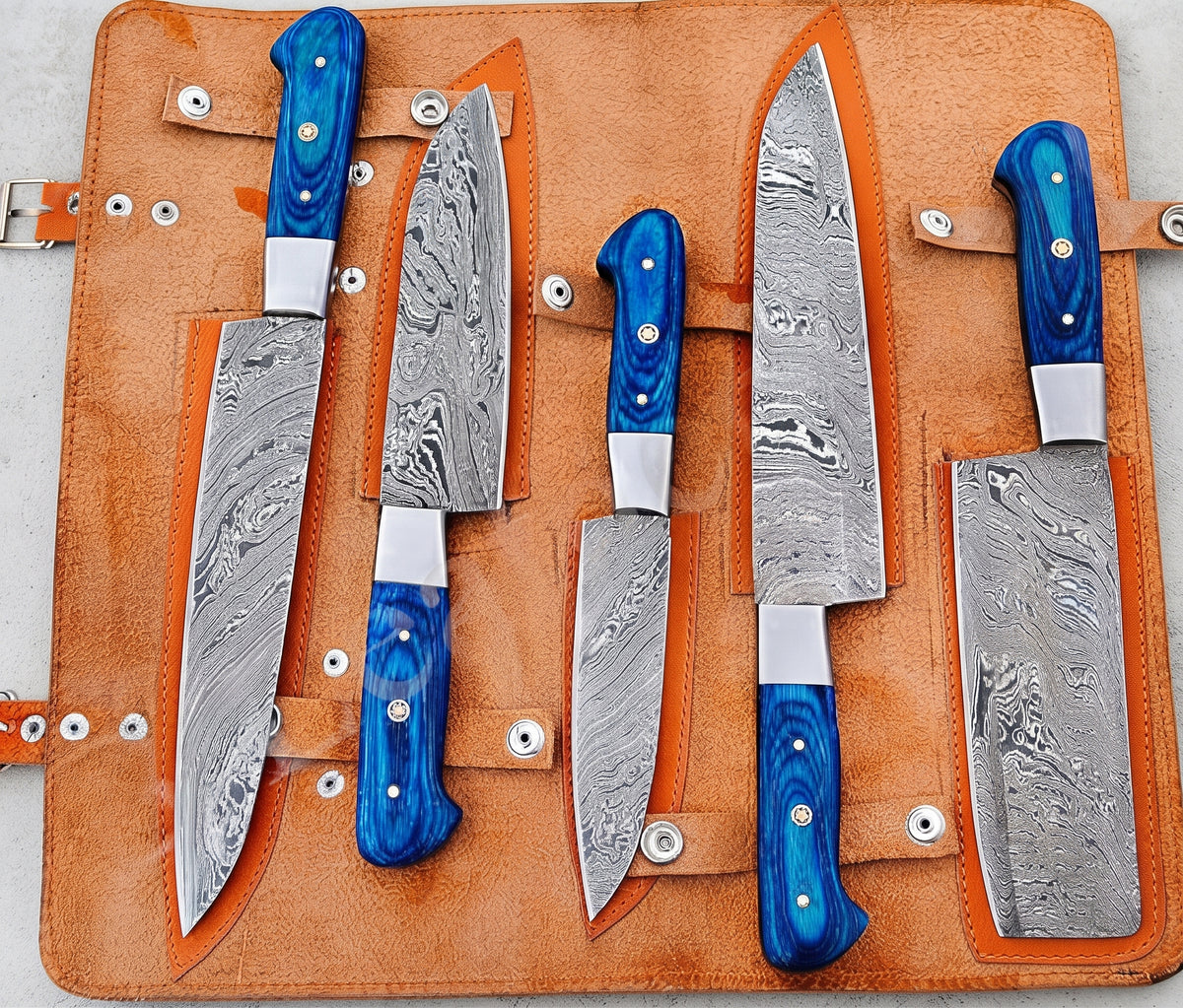 5 piece knife set with blue handles in leather case