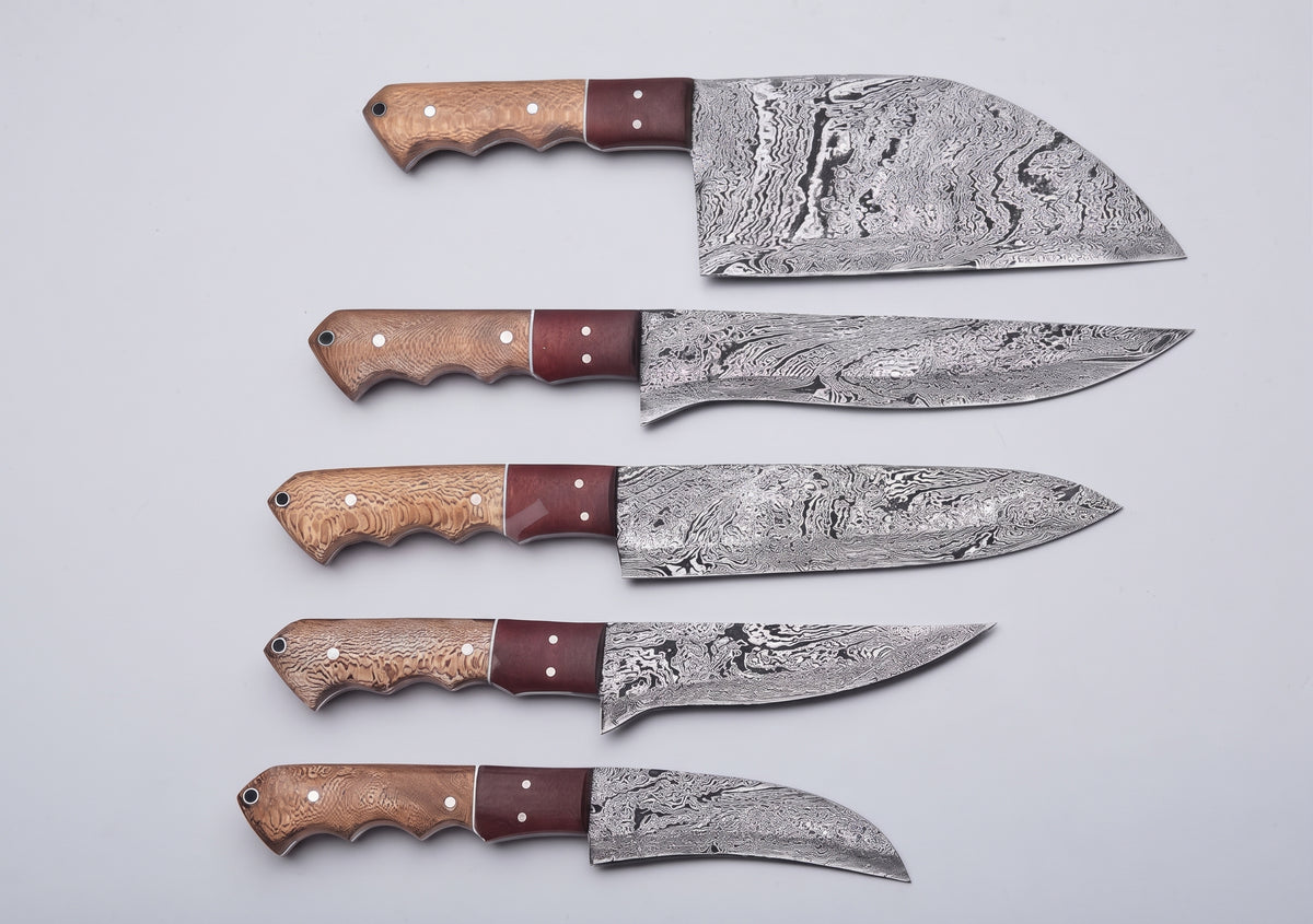 5 piece Damascus knife set lined up on white background