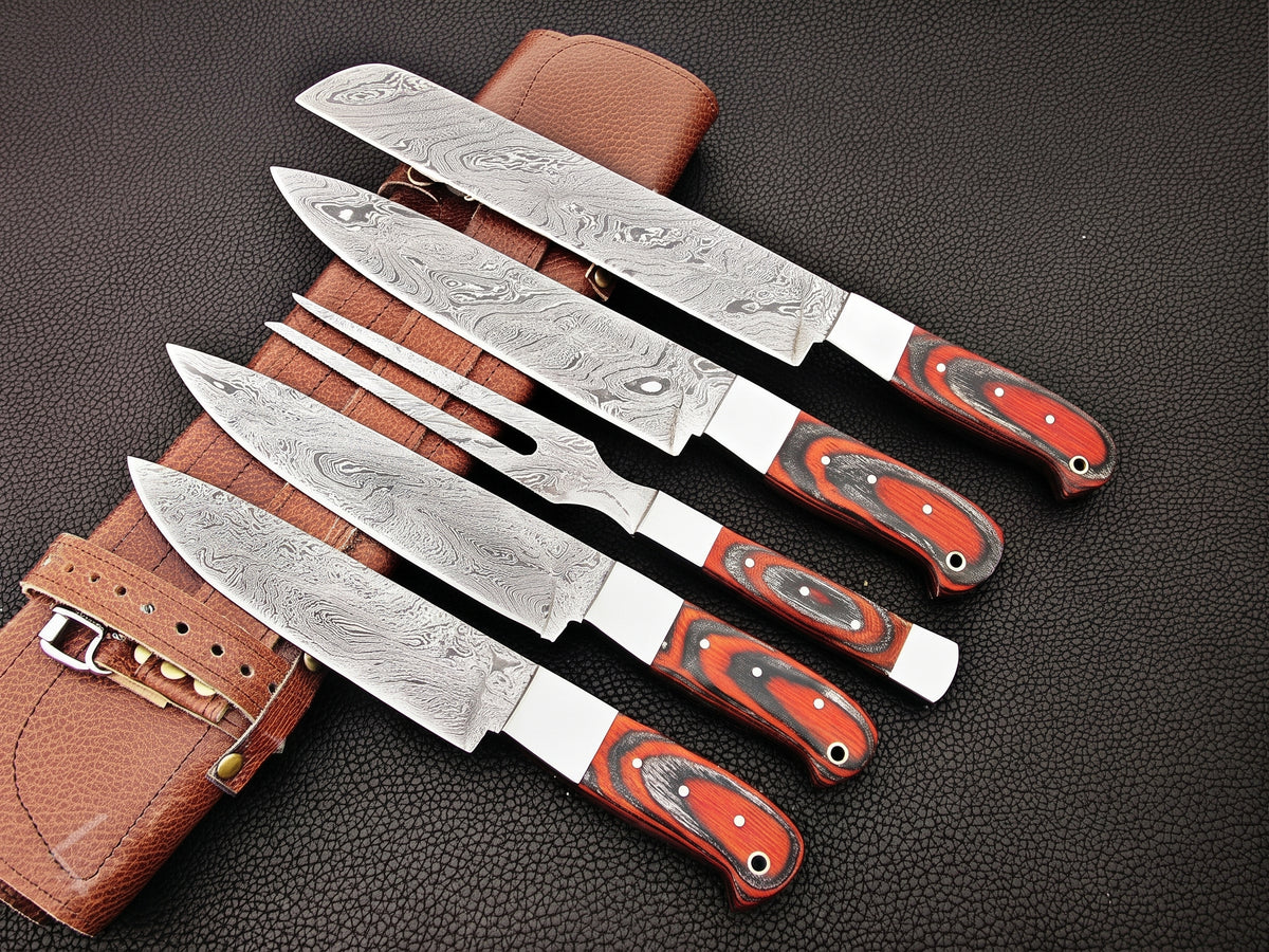 5 piece carving knife set with red and black handles on leather