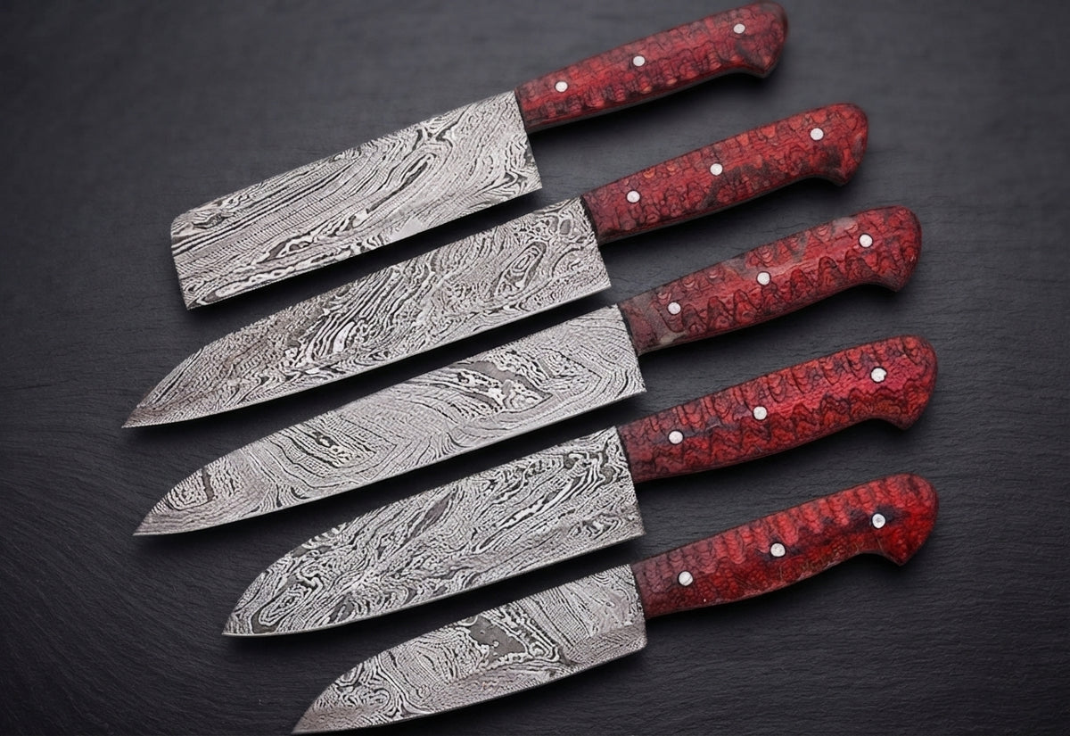 5 Damascus knives with textured red handles fanned out