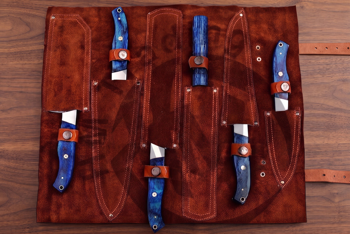 Leather roll case open showing blue pakka wood knives nested in their individual pockets