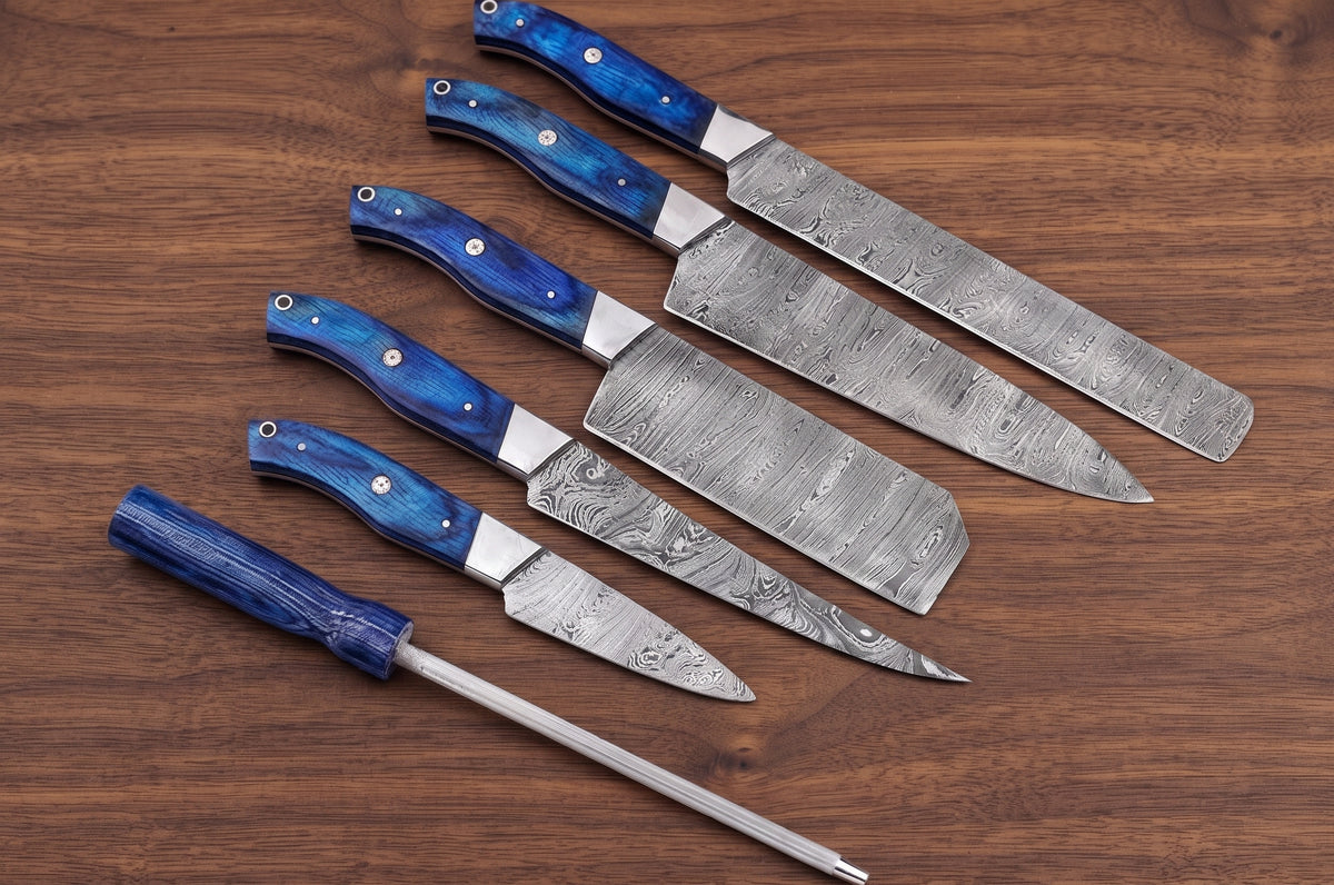 Full lineup of Damascus steel blades with blue pakka wood handles and a matching rod