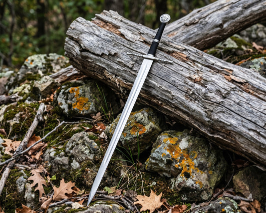 Decorative sword with black cord wrapped grip, twisted crossguard and round pommel leaning on a weathered log