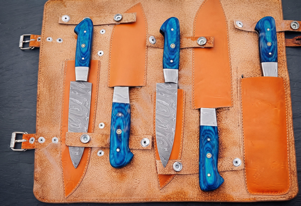 5 piece knife set with blue handles arranged diagonally