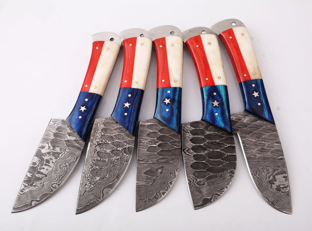 Damascus steel knives with star handles being arranged into the leather roll case pockets