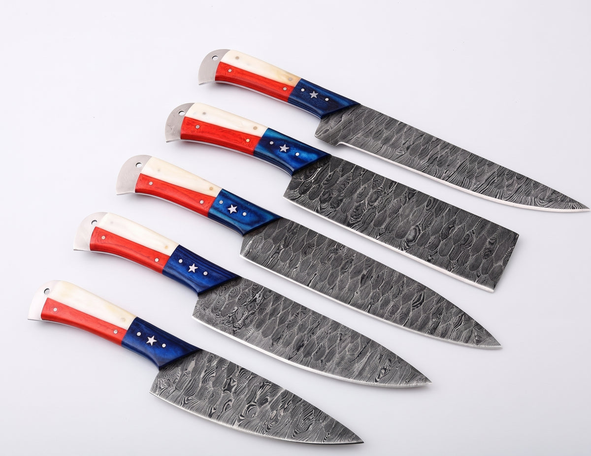 Five Damascus steel blades with red, white and blue star handles arranged in a row