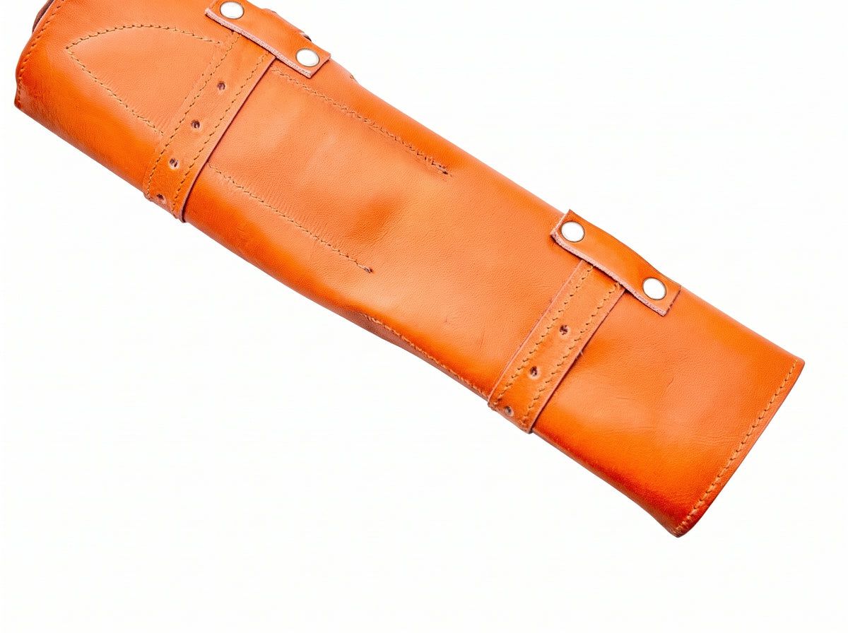 Orange leather knife roll case closed