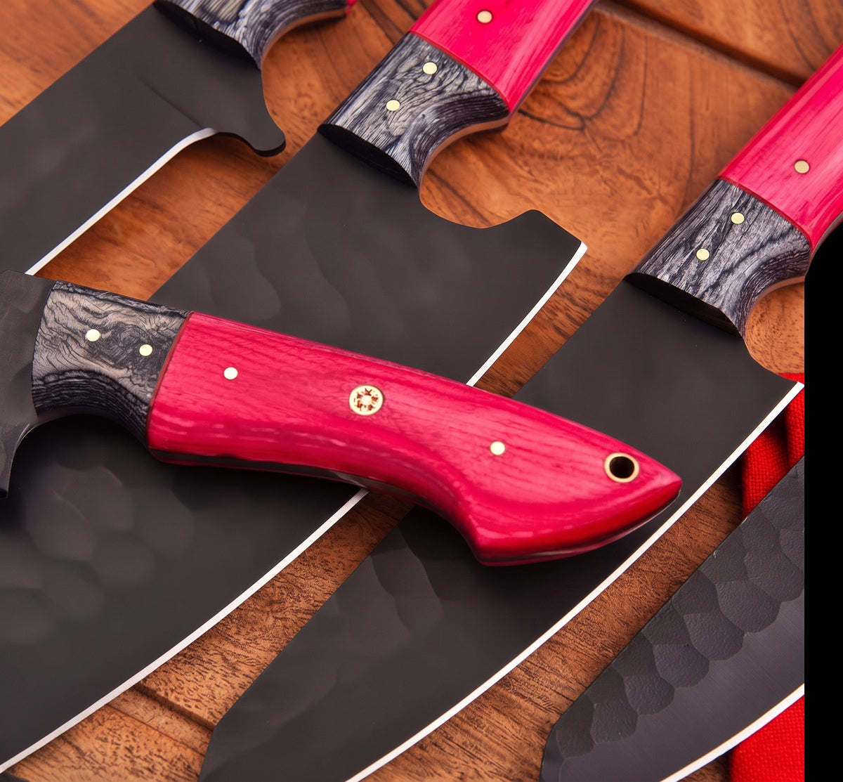 Close up of pink knife handles with black blades
