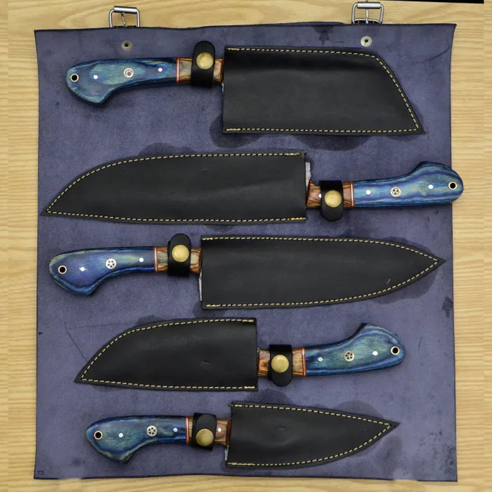 Damascus chef knife set with blue pakka wood handles beside leather roll case
