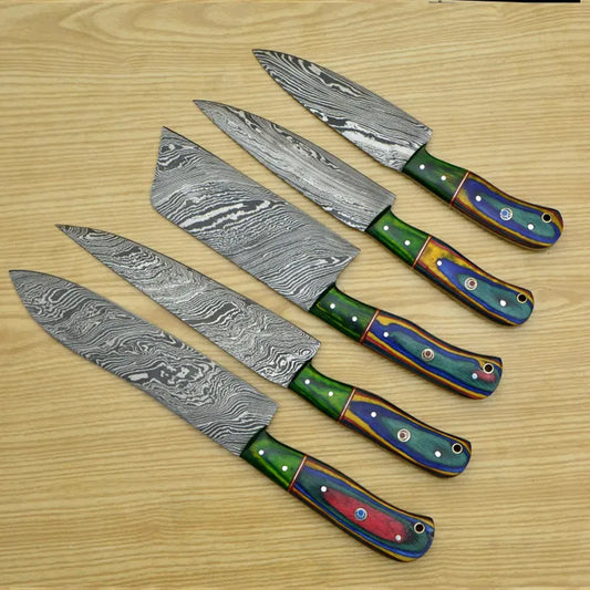 Five Damascus steel kitchen knives with varied Pakka Wood handles arranged in a fan