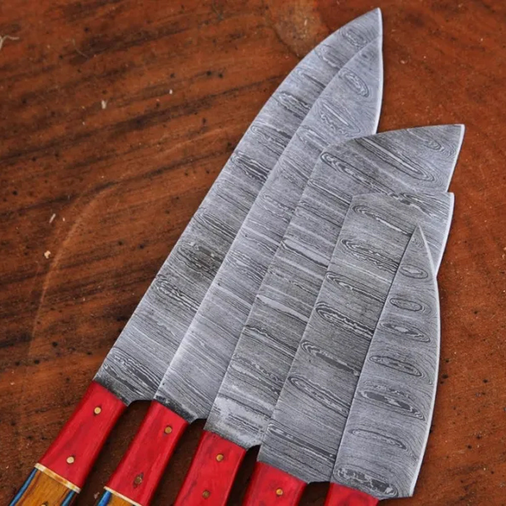 Damascus steel chef knife blades fanned out showing forged pattern
