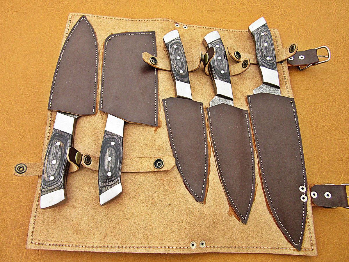 Custom Damascus steel culinary knife set stored securely in a brown leather roll bag