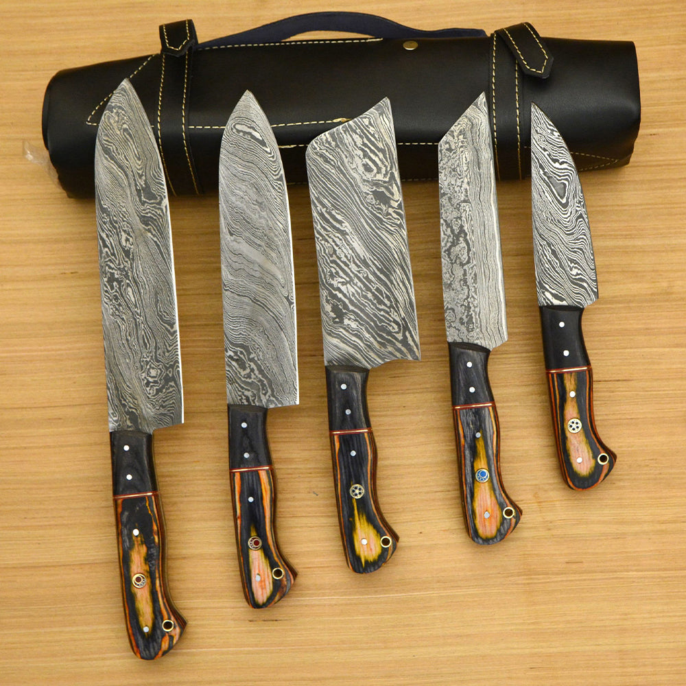 Damascus chef knife set fanned out beside black leather roll case