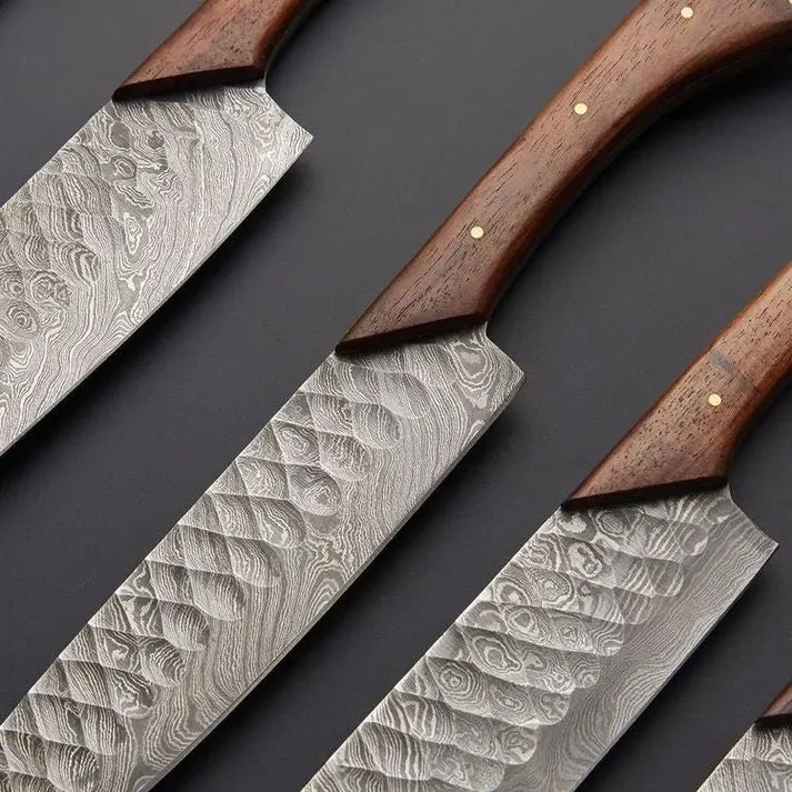 Hammered Damascus blades close up showing the dimples and flowing layers