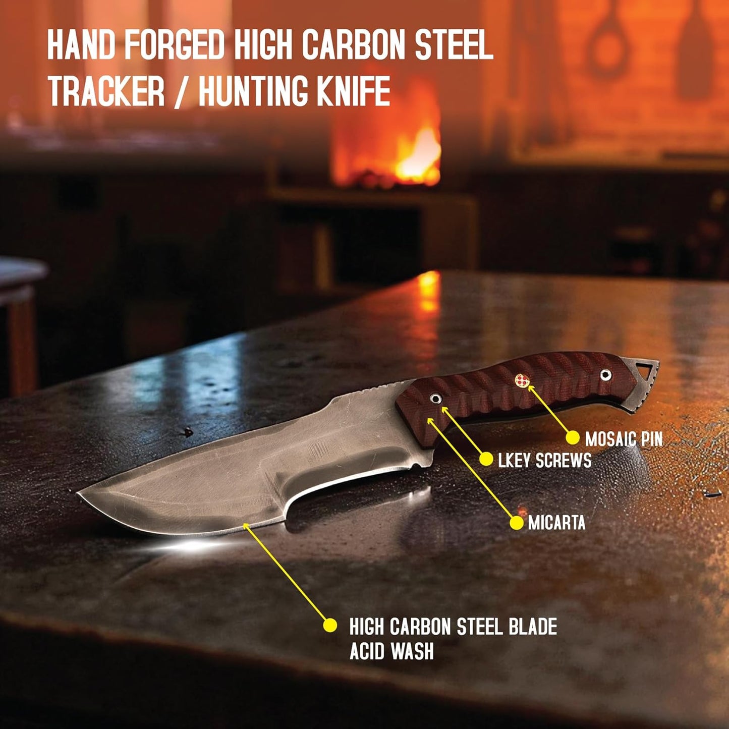 Annotated full tang tracker knife on a workbench. Labels highlight the acid-washed high carbon steel blade, brown Micarta handle, and mosaic pin.