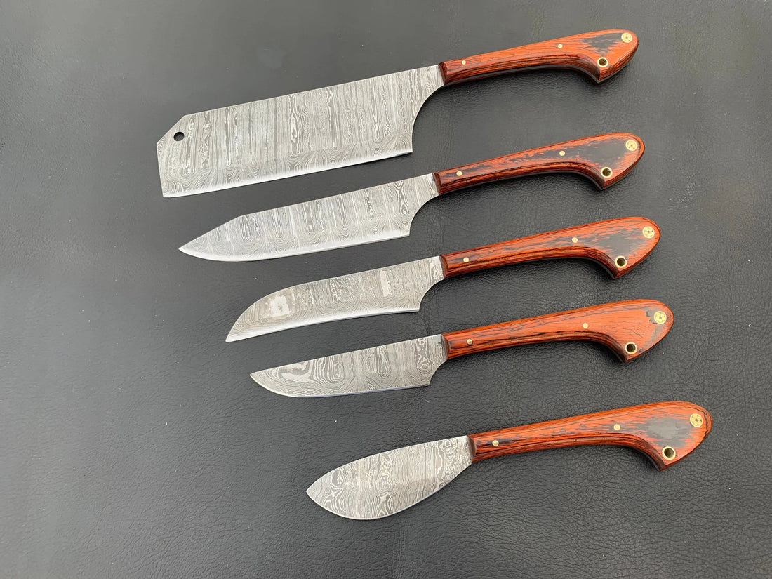 Damascus kitchen knife set of five with orange pakkawood handles and brass pins