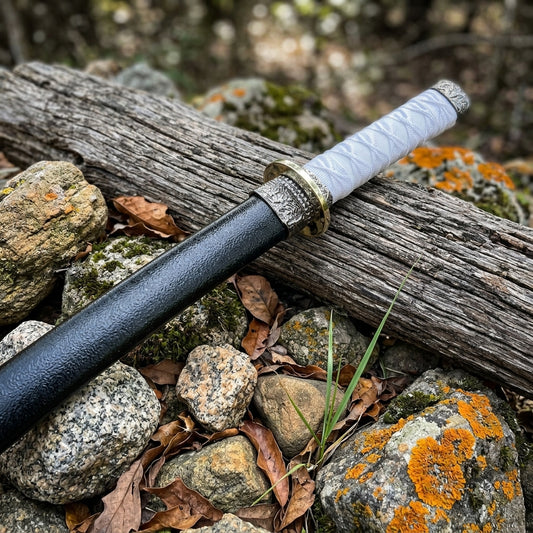 Japanese tanto knife showing polished stainless steel blade and traditional wrapped handle