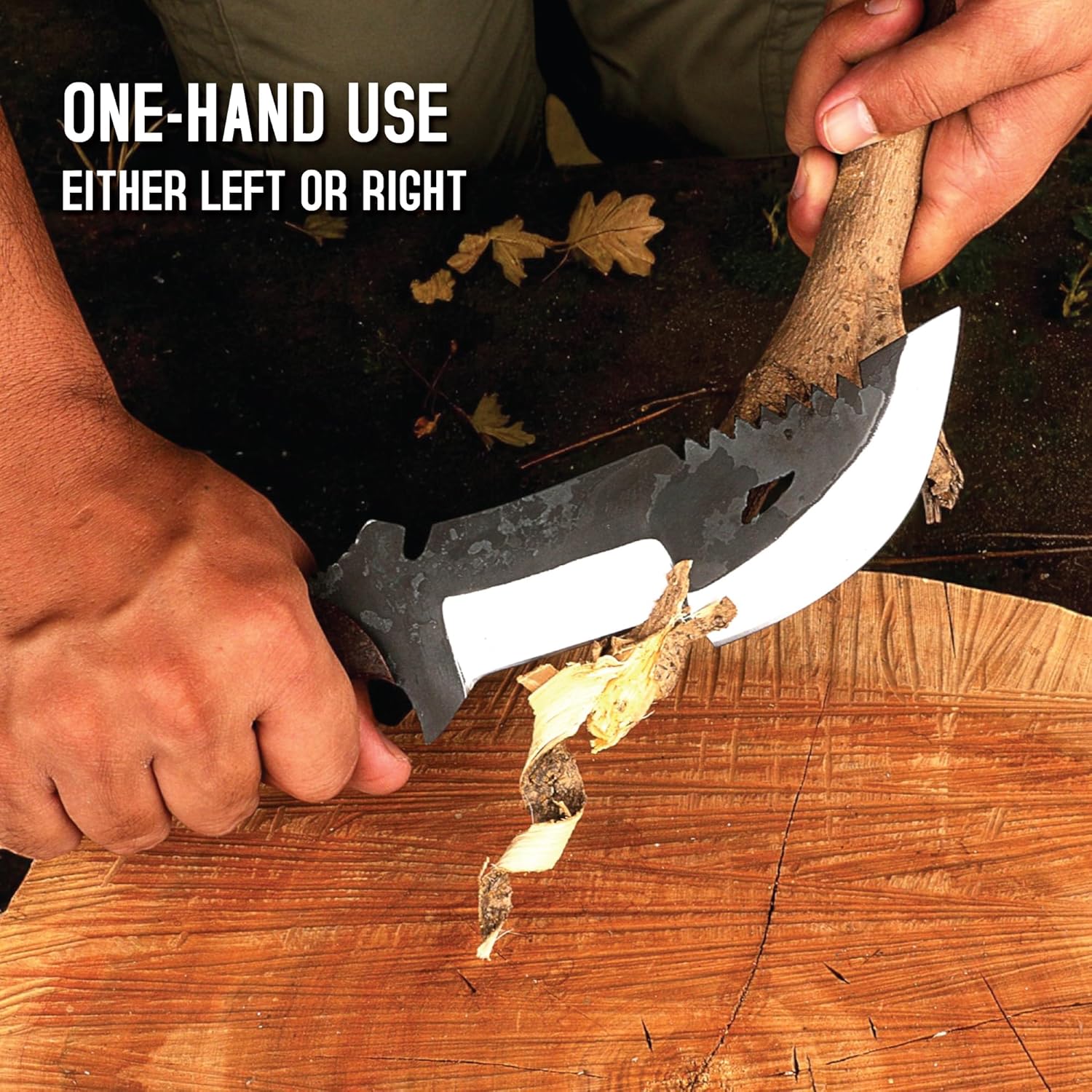 An action shot showing a person's hands using a survival tracker knife to carve a thick branch over a large, textured wooden stump. The person's left hand grips the dark handle, utilizing the polished, straight cutting edge of the blade to shave off thick, curling strips of wood from the branch held in their right hand. The distinctive two-toned blade is clearly visible, featuring the dark, mottled upper section with saw teeth and a cutout. In the upper left corner