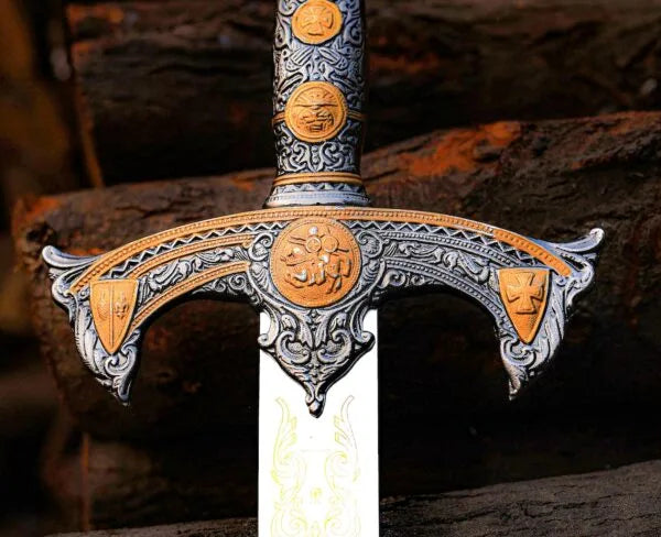 Close up of ornate sword hilt and guard on forest log